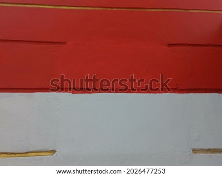 The walls are painted red and white with the Indonesian flag.