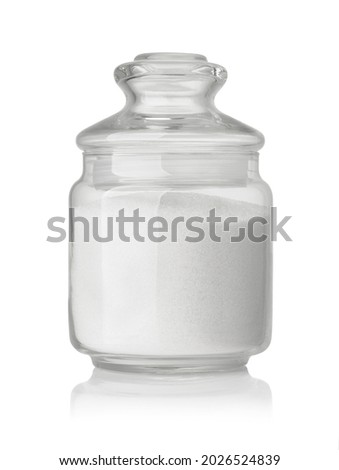 Front view of  refined granulated sugar in glass jar isolated on white Royalty-Free Stock Photo #2026524839