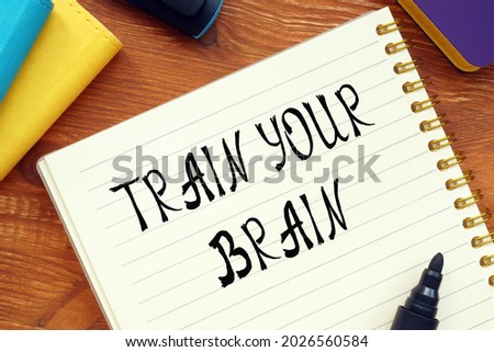 Conceptual photo about TRAIN YOUR BRAIN question marks with written text. 
