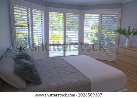 Luxury white indoor plantation shutters in bedroom - selective focus	 Royalty-Free Stock Photo #2026589387