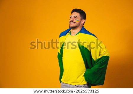 Brazilian football fan emotions: celebrating, excited, happy. Supporter of Brazil national soccer team is cheering. Royalty-Free Stock Photo #2026593125