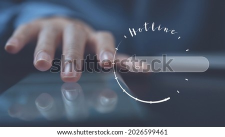 Hotline, customer service center, mockup helpline phone number. Woman touching on mobile phone screen with hotline customer support centre sign on virtual screen, blank space for phone number and text Royalty-Free Stock Photo #2026599461