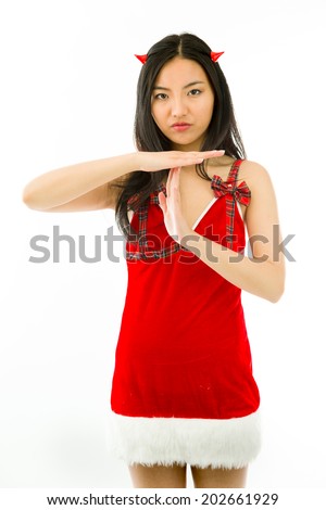 Devil side of a young Asian woman making time out signal with hands isolated on white background