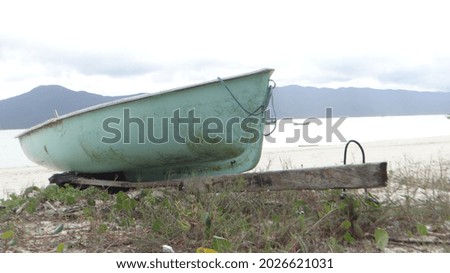 Landscape with a boat on top of trailer.