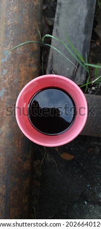 top view black Coffee with pink mug 