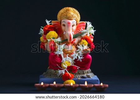 Decorative Lord ganesha sclupture on dark background.