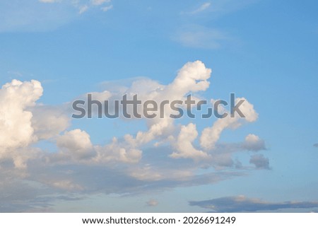 white clouds against blue sky on natural light background