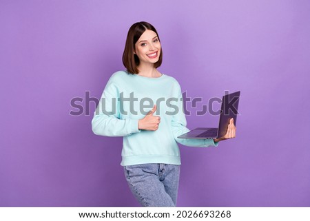 Photo portrait girl recommending showing thumb-up laptop isolated pastel purple color background