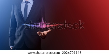 Businessman man holding an plane airplane icon in his hands. Online ticket purchase.Travel icons about travel planning, transportation, hotel, flight and passport.Flight ticket booking concept.