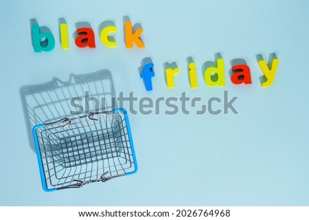 Shopping cart on blue background. Minimalism style. Shop trolley at supermarket. Sale, discount, shopaholism concept.