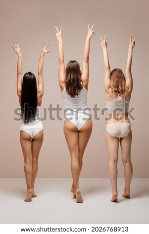 Back view of group of women with different body