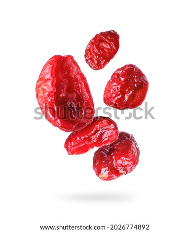 Dried cranberries close up in the air on a white background Royalty-Free Stock Photo #2026774892