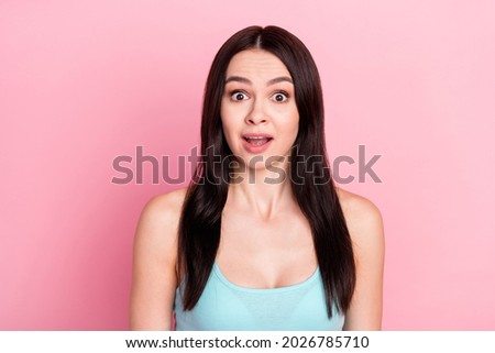 Photo of startled brown long hairdo lady look open mouth wear blue top isolated on pastel pink color background