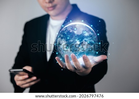 Global network connection. Concept of digital business big data connection. Businessmen use smartphones and hold virtual worlds. Elements of this image furnished by NASA