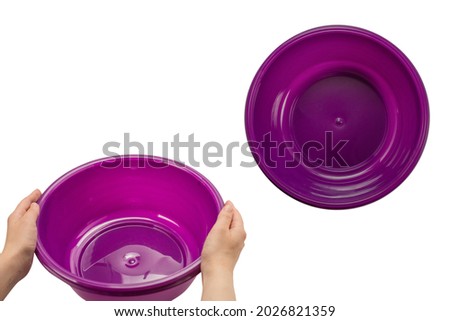 Purple hand basin in woman hands isolated on white background.