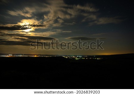 Moonlit summer night near a village in a field in Ukraine
