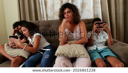 Mother and children taking selfie together with phone