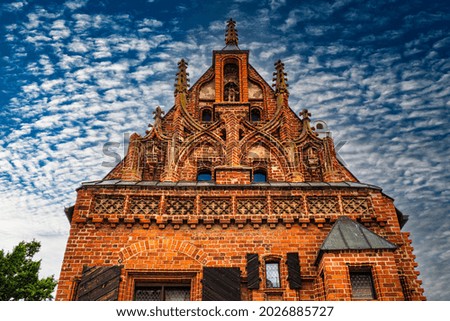 Gothic Style Architecture on the Cloudy Blue Sky Background