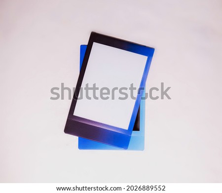 Frame with blue and purple border on white background. Two blank photo frames on white background as template. Photo cards with space for your logo or text.  Royalty-Free Stock Photo #2026889552