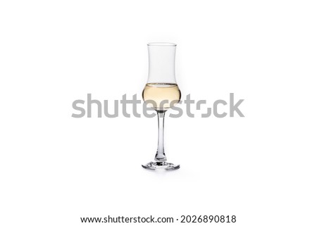 Italian golden grappa drink isolated on white background Royalty-Free Stock Photo #2026890818
