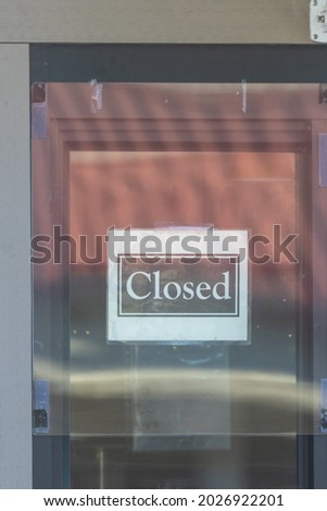 closed sign on local business due to covid