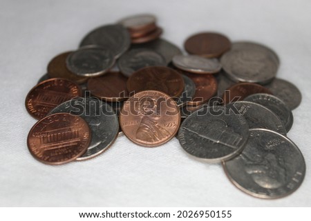 Small collection of american coins. 1, 5, 10 and 25 cents coins. Royalty-Free Stock Photo #2026950155