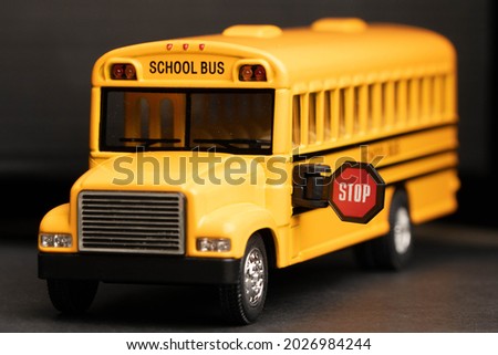 School bus model with stop sign. Do not pass the school bus. The stop signal arm.