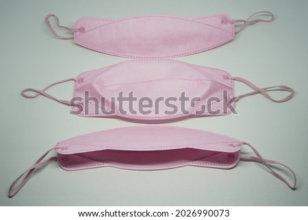 Pink medical masks are usually used by women to protect themselves from the corona virus covid 19 during the pandemic.