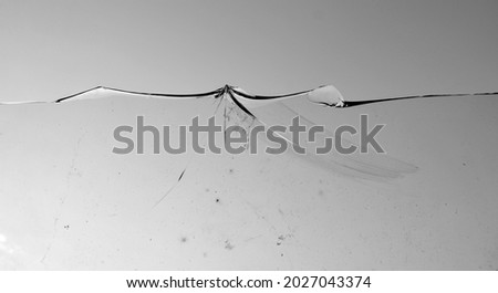 Texture broken glass with cracks. Abstract of cracked screen Smartphone from shock. Smart phone with broken screen isolated on white background. broken glass background. Broken glass  an crack. 