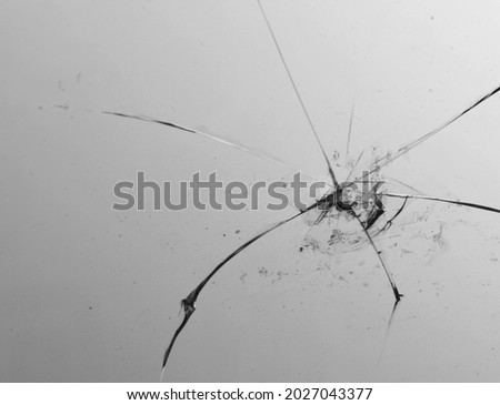 Texture broken glass with cracks. Abstract of cracked screen Smartphone from shock. Smart phone with broken screen isolated on white background. broken glass background. Broken glass  an crack. 