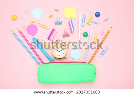 School supplies on pink background