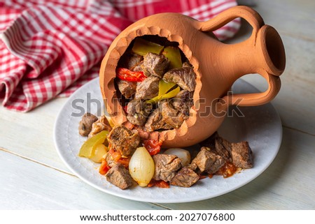 Authentic Turkish Testi Kebab cooked in earthenware waterjug, Turkish name; Testi kebabi Royalty-Free Stock Photo #2027076800