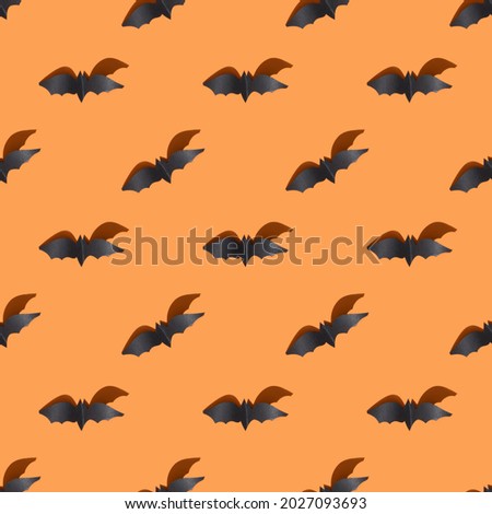 Halloween seamless pattern of black bats with shadow on orange background.