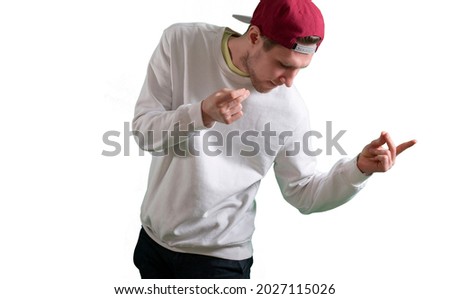 feeling happy and free, enjoying life, a young man dancing and moving, isolated white background