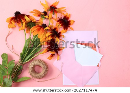 Autumn flower arrangement, abstract flat lay background with place for text, minimal holiday concept, thanksgiving day. Greeting card with seasonal flowers, selective focus