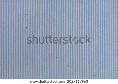 abstract background of an old stripped furniture upholstery in cold tones