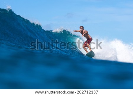 Surfing a Wave. Lombok Island. Indonesia.