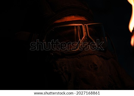 Fire reflection in a gas mask macro