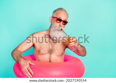Photo of old man drink alcohol enjoy cocktail wear rubber circle sunglass isolated turquoise color background Royalty-Free Stock Photo #2027190554