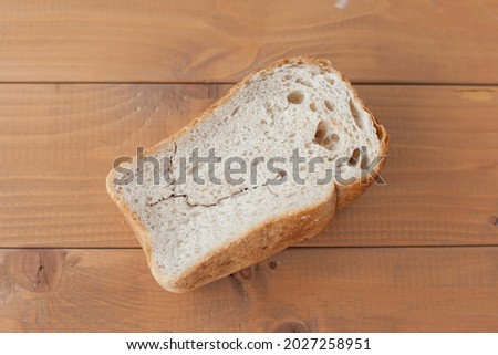dry bread loaf on the table. old food