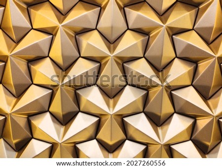 Bronze 3D interior decorative wall panel with unusual geometric shape. Brown metallic background with pattern. Abstract texture. High quality photo