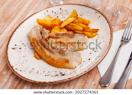 Image of fried pork bacon on a plate and French fries...