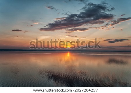 Amazing landscape at sunset. Colorful sunrise on the ocean or sea beach. Colorful nature sea sky