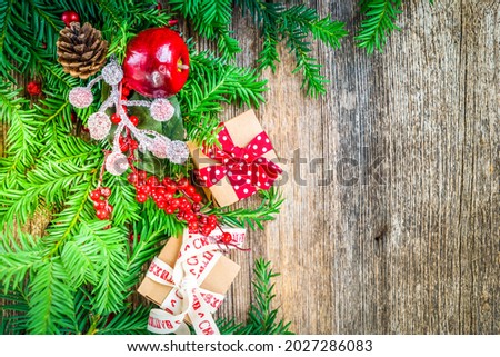 Christmas gift giving and zero waste concept - christmas gift box, border on wooden background