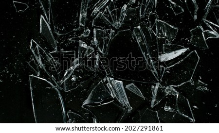 Break glass isolated on black background, top shot. Royalty-Free Stock Photo #2027291861