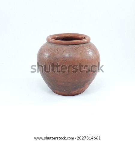 Terracotta barrel of clay on a white background