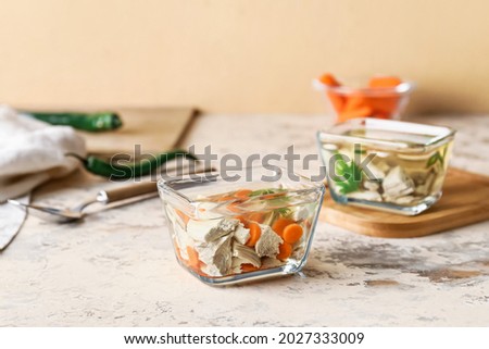 Bowl of tasty aspic on table
