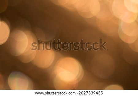 Background with bokeh for design. Natural golden lights.