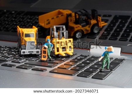 Heavy-duty vehicles model show on the black background.  and model of humans construction for online builder.