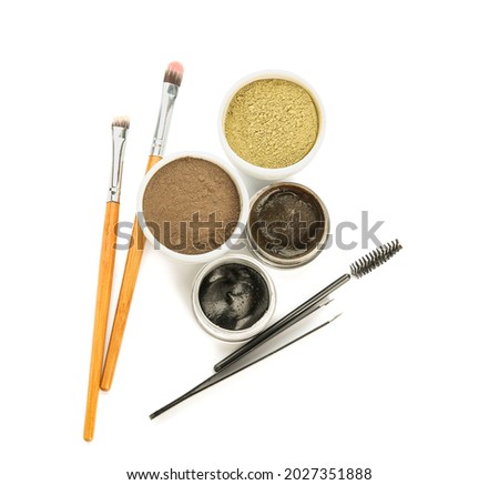 Natural henna and tools on white background